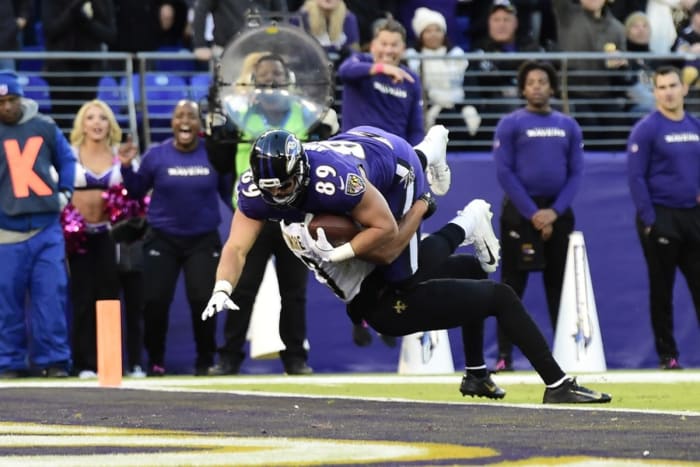 Baltimore Ravens tight end Mark Andrews (89) runs through New Orleans Saints cornerback Marshon Lattimore (23) for a touchdown. Mandatory Credit: Tommy Gilligan-USA TODAY Sports
